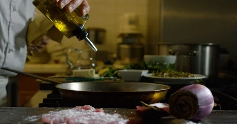 Preparing the pan to cook meat 4k Stock Footage 85836032