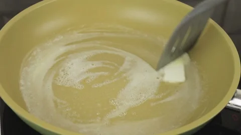 Preparing the pan for frying Stock Footage 147172011