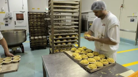 Preparing pastries at a commercial bakery Stock Footage 1087363
