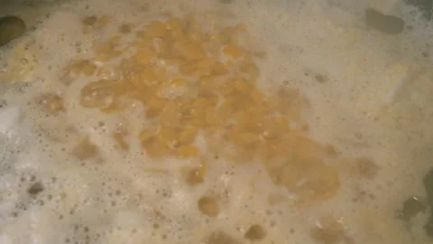 Preparing pea soup of split dry yellow peas. Stock Footage 130417318