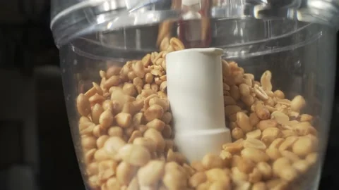 Preparing peanut butter - blender and peanuts - macro of puring 库存影片 199595315