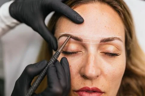 Preparing for perfect eyebrows, premicroblading design and makeup process Stock Photos