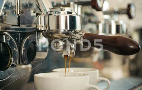 Preparing to perfection. Small cups to serve hot coffee drinks. Coffee cups Stock Photos