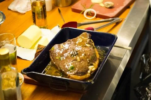 Preparing a piece of meat to be roasted Stock Photos
