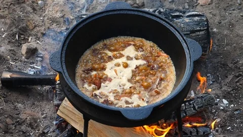 Preparing Pilaf In Cauldron On Fire. Cooking In Nature. Stock-Footage 111759950