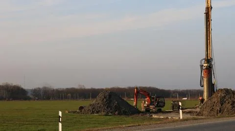 Preparing a pile foundation at a roadside construction site Stock Photos