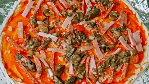 Preparing the pizza for baking Stock Footage
