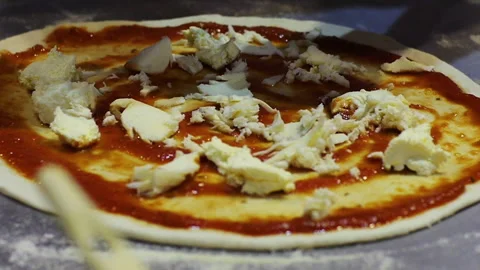 Preparing Pizza in a close up shot Stock Footage 247462023