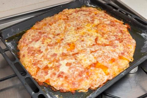 Preparing the pizza dough with cheese Stock Photos