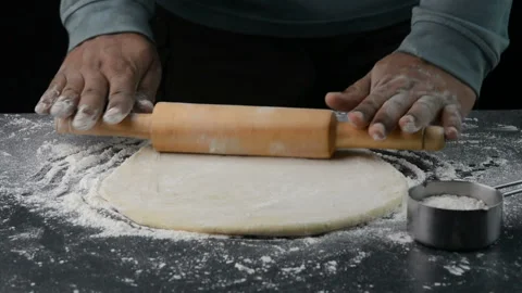 Preparing pizza dough using rolling pin 動画素材 163944879