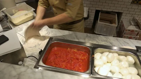Preparing Pizza dought on a marble countertop. 库存影片 141804003