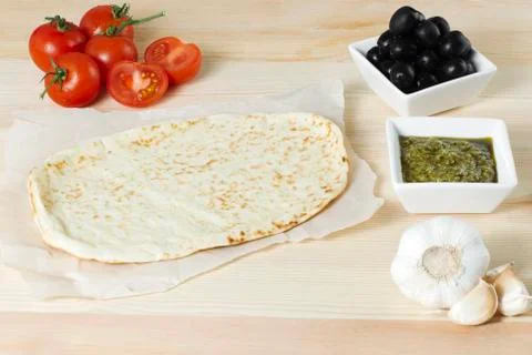 Preparing pizza ingredients on the table Stock Photos