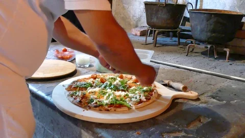 Preparing pizza in old rustic kitchen Stock Footage 77376949