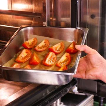 Preparing plum tomatoes Stock Photos