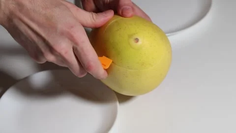 Preparing pomelo for snack time with a specialized knife. Stock Footage 326975870