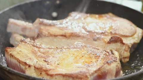 Preparing of pork chops in a frying pan. Stock Footage 165622078