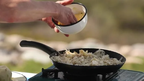 Preparing potato rosti in a cooking pan Stock Footage 133749451