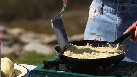 Preparing potato rosti in a cooking pan Stock Footage 133749652