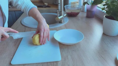 Preparing potato slices for frying in kitchen, Concept of comfort food 库存影片 341985921