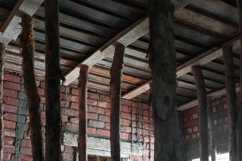 Preparing to pour concrete for the ceilings of the next floor of a brick house. Stock Photos