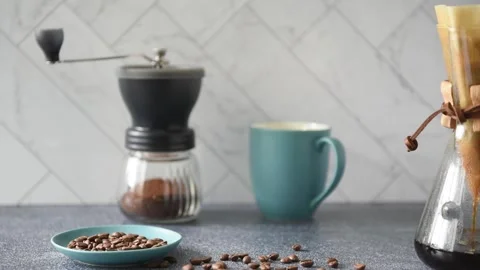 Preparing Pour-over Coffee on a bright kitchen counter with marble backsplash Stock Footage 233112540