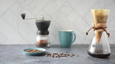Preparing Pour-over Coffee on a bright kitchen counter with marble backsplash Stock Footage 233112588