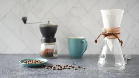 Preparing Pour-over Coffee on a bright kitchen counter with marble backsplash Stock Footage 233112737