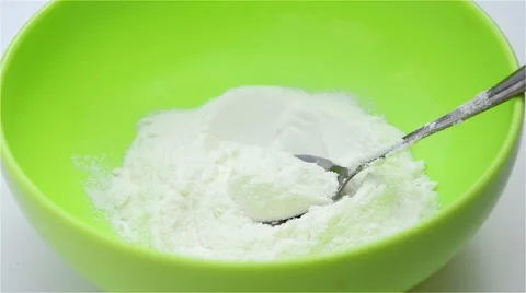 Preparing powdered milk in a bowl Stock Footage 54333618