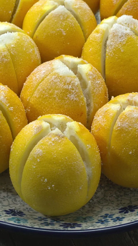 Preparing preserved lemons. Table spin. Vertical video. Stock Footage 279578776