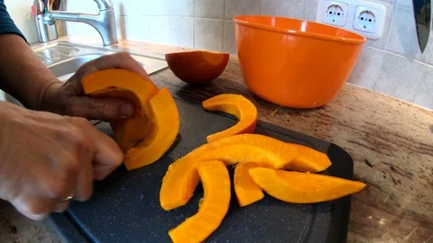 Preparing pumpkin in the kitchen, authentic works, homemade, 4K Video stock 97952133