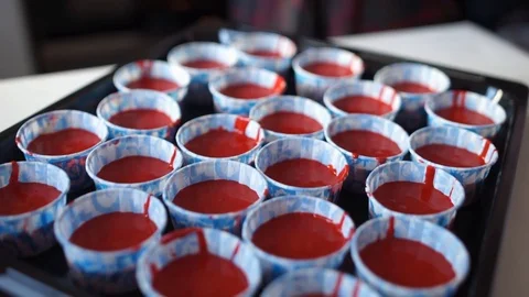 Preparing to put cupcakes in oven Stock Footage 89581954