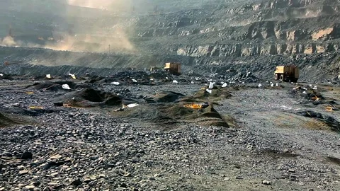 Preparing a quarry for an explosion. Placing a charge in the soil for blasting Video stock 162123016