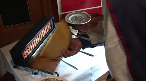 Preparing a raclette religieuse Stock Footage 32509031