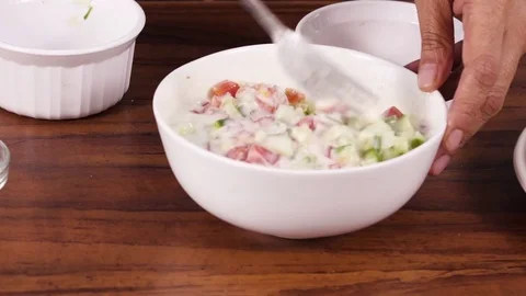 Preparing  Raita(chutney)  for parathas(stuffed flat bread) 動画素材 83074626