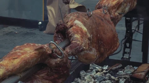 Preparing a ram on a spit Stock Footage 76248729