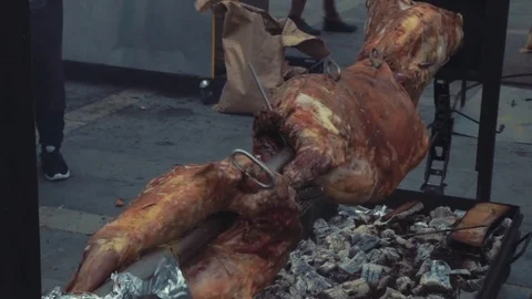 Preparing a ram on a spit Stock Footage 76248776