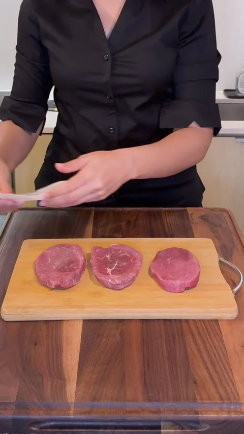 Preparing Raw Beef Steaks on Cutting Board, Slow Motion Vertical Stock Footage 331050403