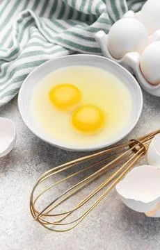 Preparing raw eggs for baking or a healthy breakfast Stock Photos