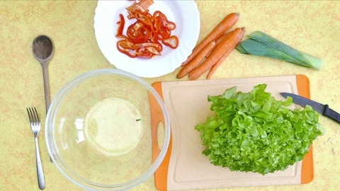 Preparing raw food. Vegetables, cutting green lettuce with knife Stock Footage 72423035