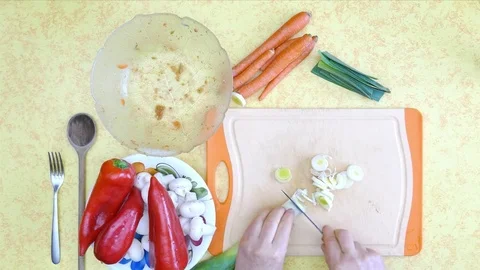Preparing raw food. Vegetables, cutting red paprika and mushrooms with knife 動画素材 72424517