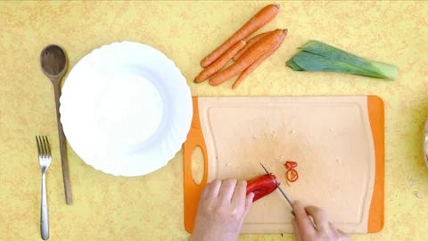 Preparing raw food. Vegetables, cutting red paprika with knife Stock Footage 72425513