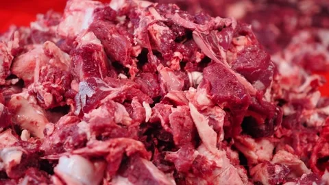 Preparing raw meat in a busy kitchen during daytime hours Stock Footage 340062439