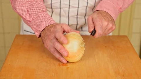 Preparing a Raw Onion Stock Footage 126655187