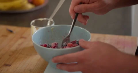 Preparing a Refreshing Fruit Bowl: Stock Footage 336141410