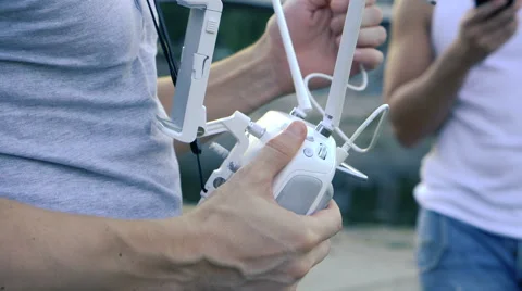 Preparing the remote control to fly drone quadrocopter Stock Footage 66111919