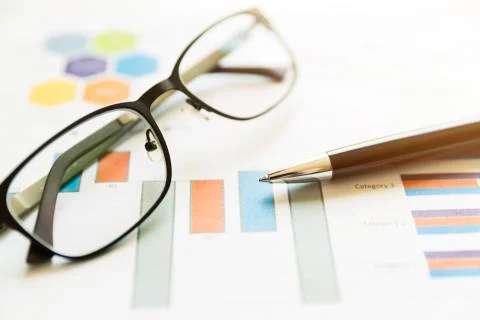 Preparing report. Graphs and charts. Business reports, glasses and pen. Busin 스톡 사진