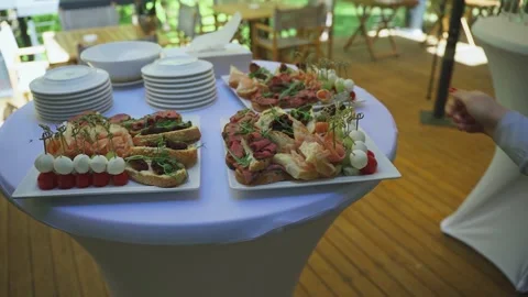 Preparing restaurant for guests to arrive for a buffet. Close-up of buffet table Stock-Footage 312768229