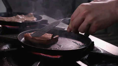 Preparing roasted cheese - turning the slice in a hot pan, close up Stock-Footage 152608110