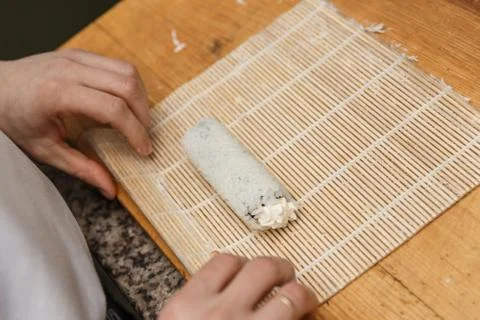 Preparing, rolling sushi. Stock Photos