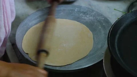 Making Roti Indian Chapati on Roti Tawa Made of Wheat Stock Image